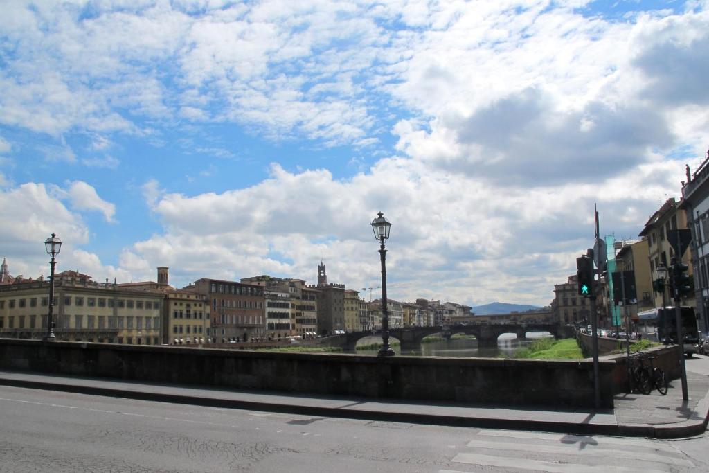 a view of a city with a bridge and buildings at Renovated Central Suites in Florence
