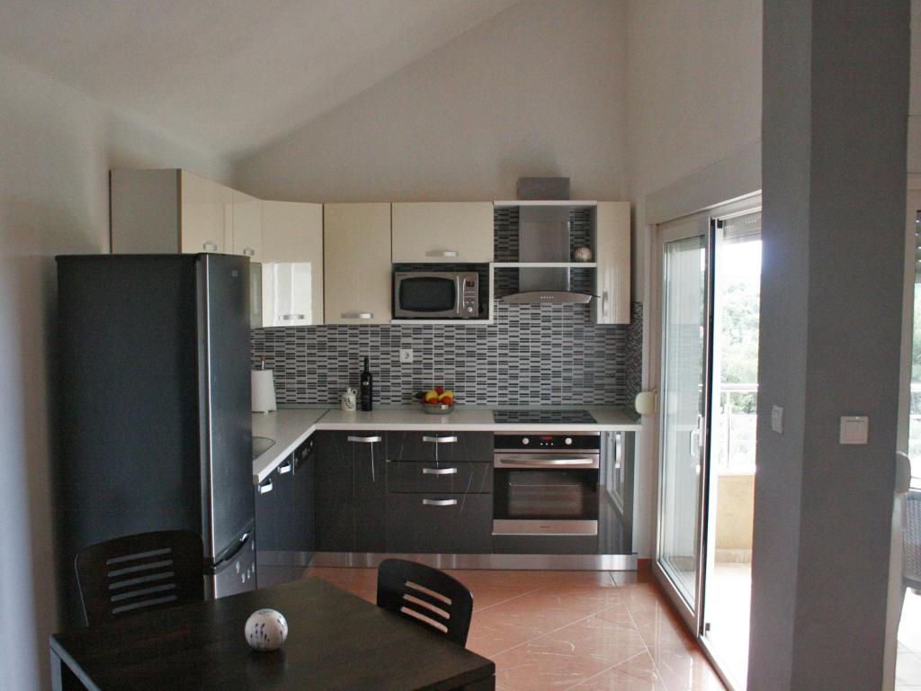 Kuchyň nebo kuchyňský kout v ubytování Apartments Kristina