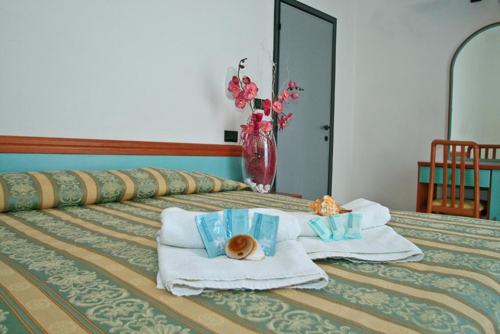 Postel nebo postele na pokoji v ubytování Hotel Vernel