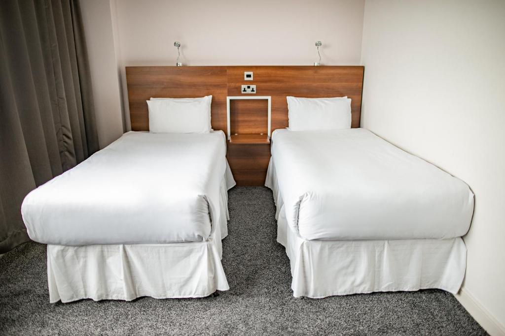 Postel nebo postele na pokoji v ubytování OX Hotel Manchester