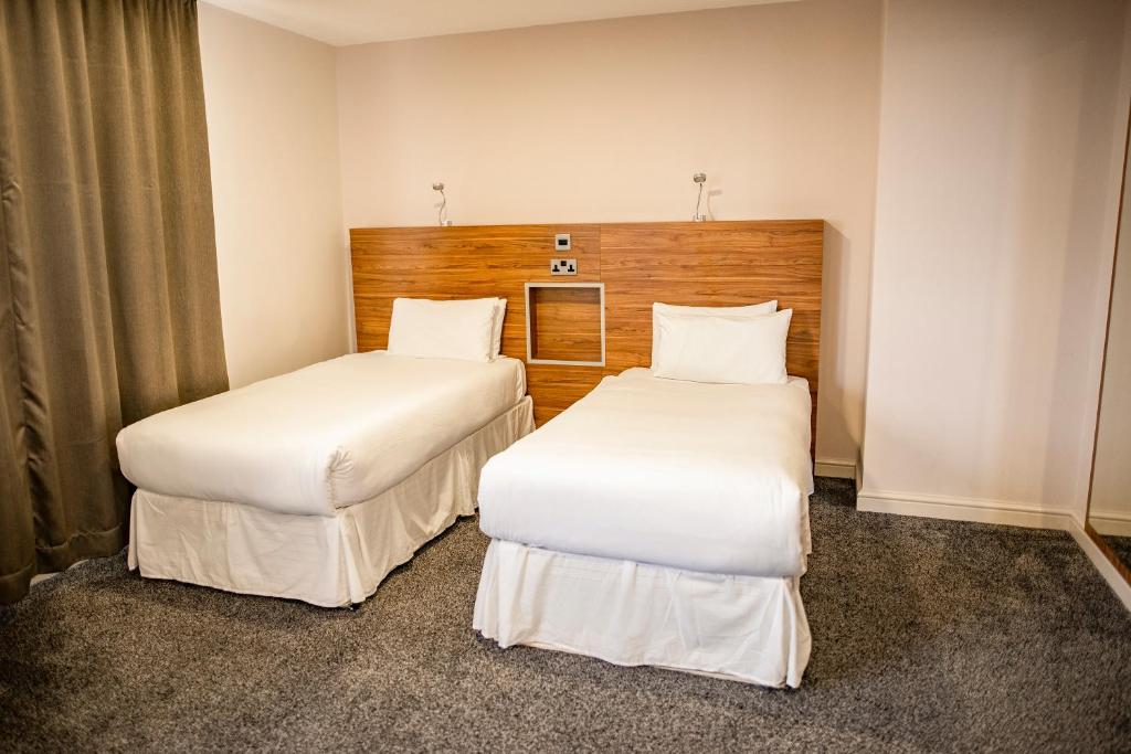 Postel nebo postele na pokoji v ubytování OX Hotel Manchester