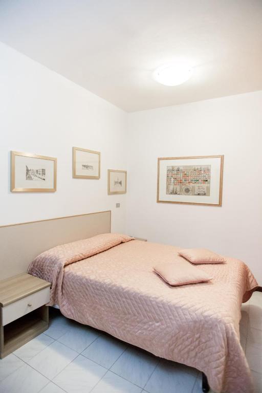 Postel nebo postele na pokoji v ubytování Hotel Europa