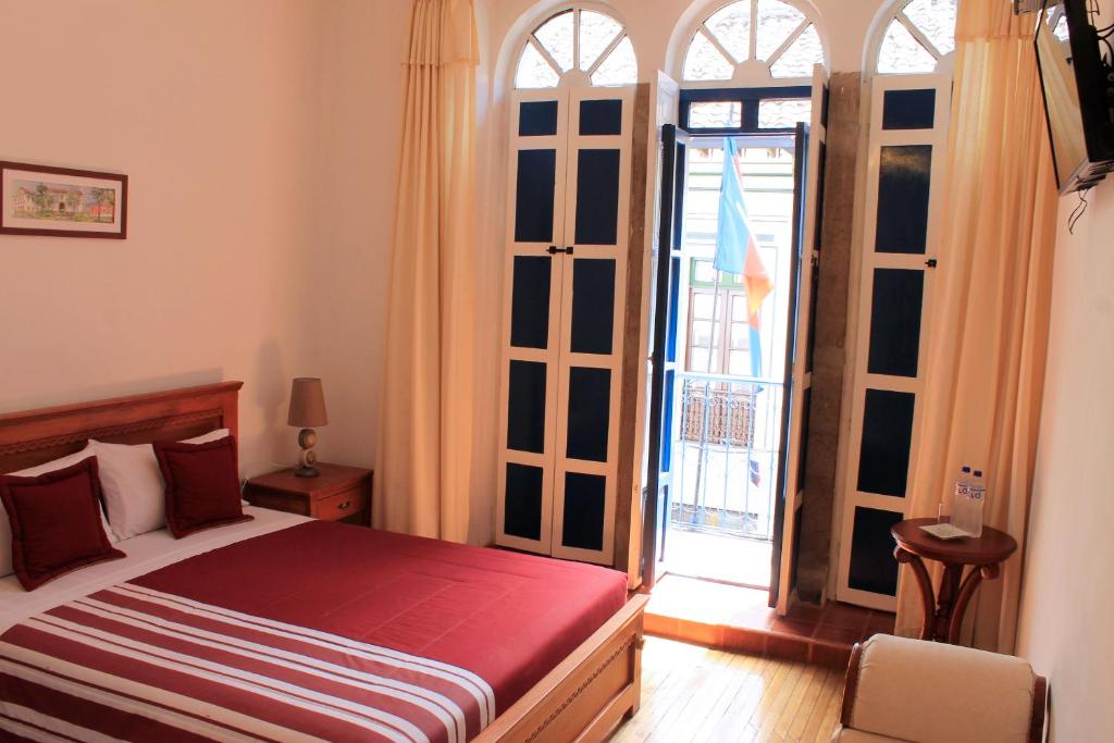 Postel nebo postele na pokoji v ubytování Casa Hotel Las Plazas