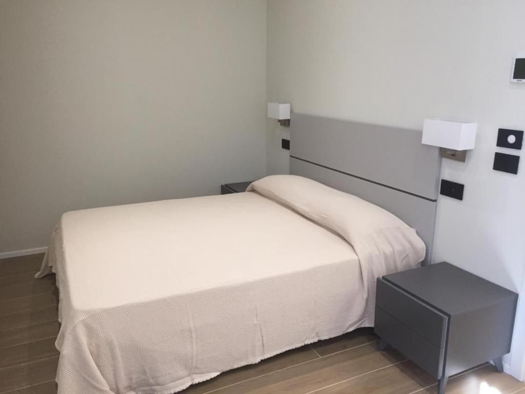 Postel nebo postele na pokoji v ubytování ROMA ROOMS