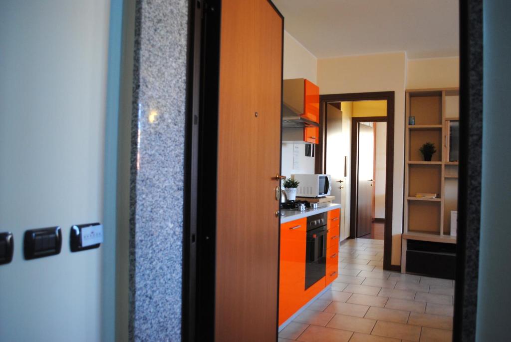 A kitchen or kitchenette at Bnbook - Volta Fiera Milano