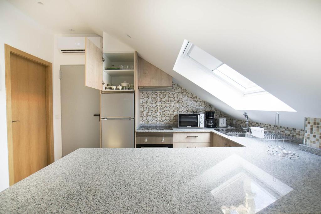 A kitchen or kitchenette at Hostel Albergue O Mesón - Habitación superior Luxury