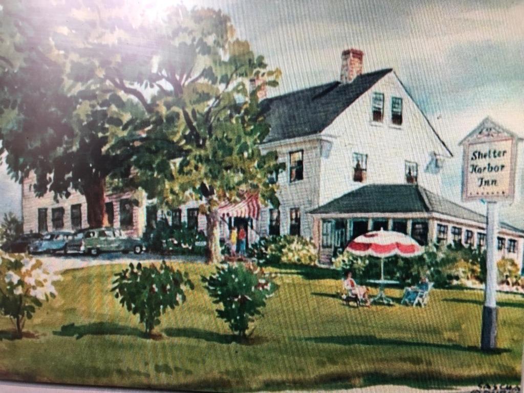 a painting of a white house with an umbrella at Shelter Harbor Inn in Westerly