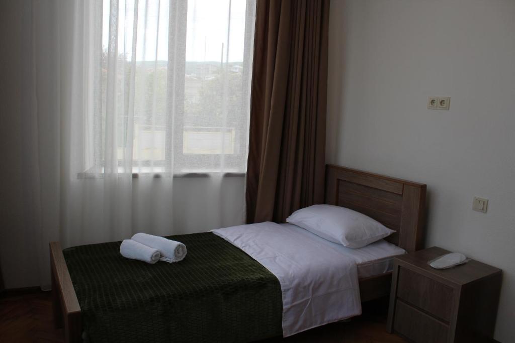 Postel nebo postele na pokoji v ubytování Guest House Chiko