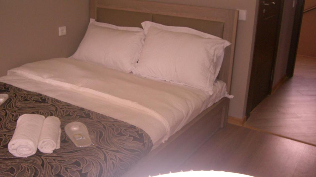 Postel nebo postele na pokoji v ubytování New Hotel