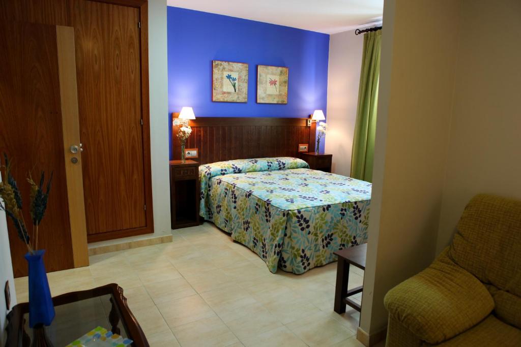 Postel nebo postele na pokoji v ubytování Hotel Rocio