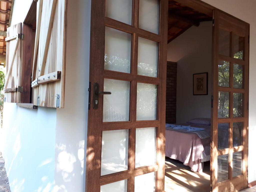 Postel nebo postele na pokoji v ubytování Chalé da Mangueira
