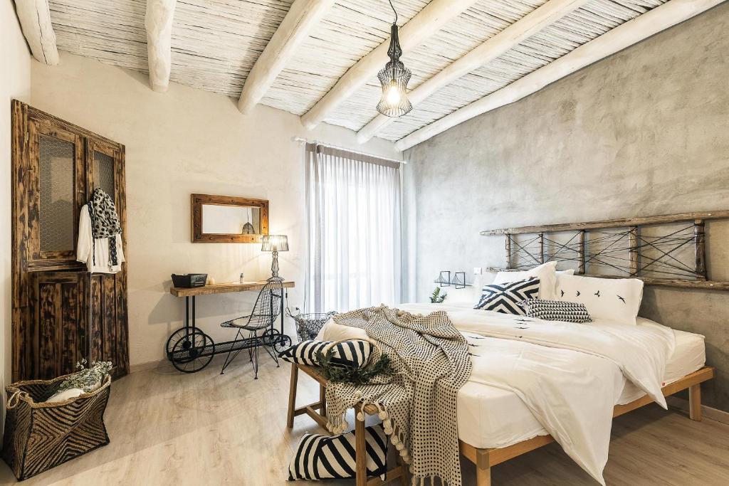 Postel nebo postele na pokoji v ubytování B&B I Cinque Mori