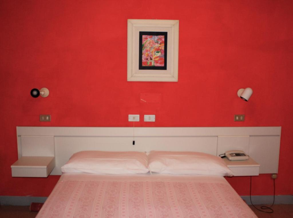 Postel nebo postele na pokoji v ubytování Albergo Villa Dionori