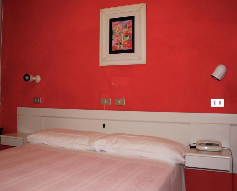 Postel nebo postele na pokoji v ubytování Albergo Villa Dionori
