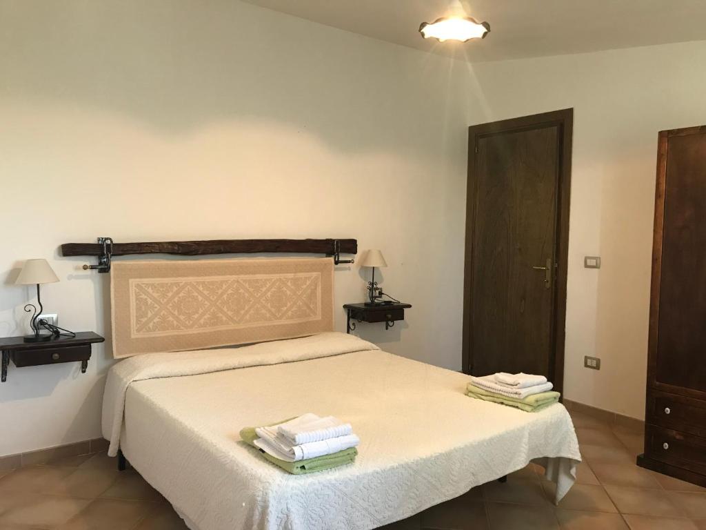 Postel nebo postele na pokoji v ubytování Villa Sa Curcurica