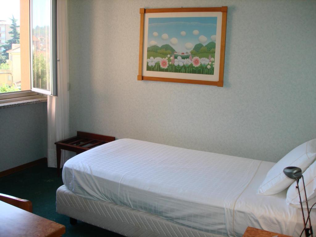 Postel nebo postele na pokoji v ubytování Hotel Ariston