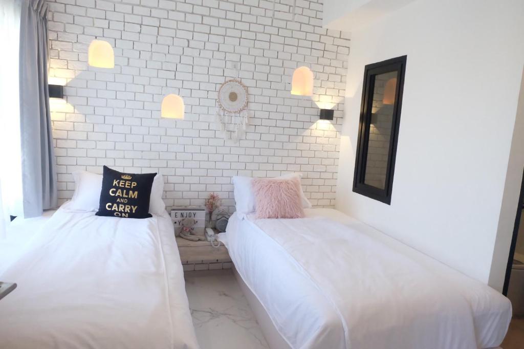 Postel nebo postele na pokoji v ubytování Bonne Nuit Hotel, Hua Hin