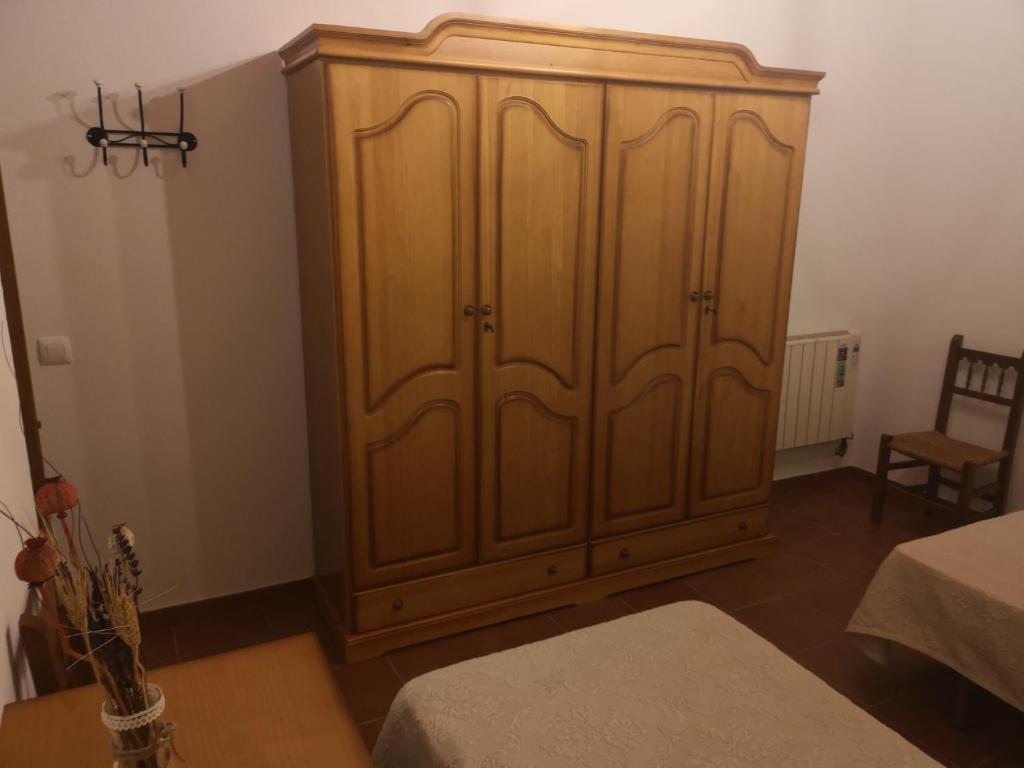A bed or beds in a room at CASA RURAL LA DEHESILLA
