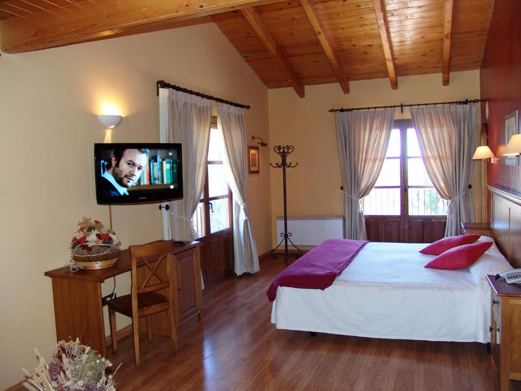 Postel nebo postele na pokoji v ubytování Hotel & SPA Peña Montañesa
