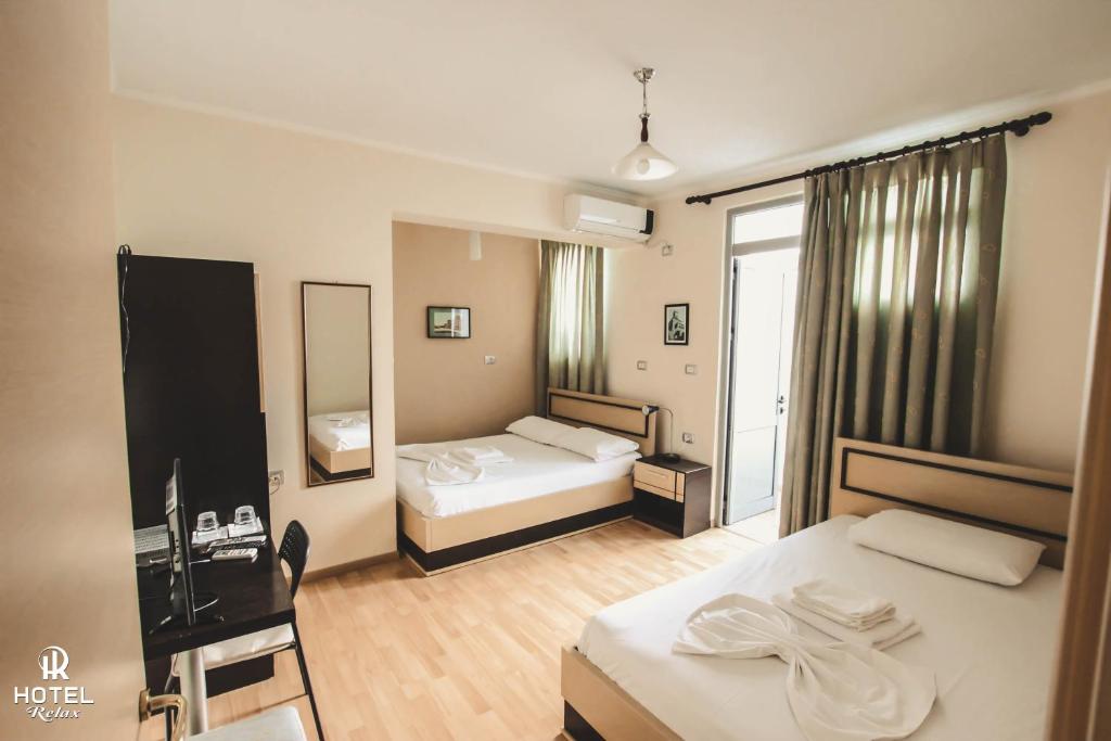Postel nebo postele na pokoji v ubytování Hotel Relax