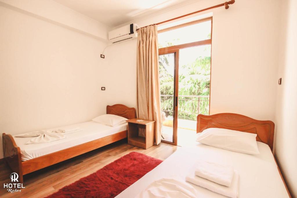 Postel nebo postele na pokoji v ubytování Hotel Relax