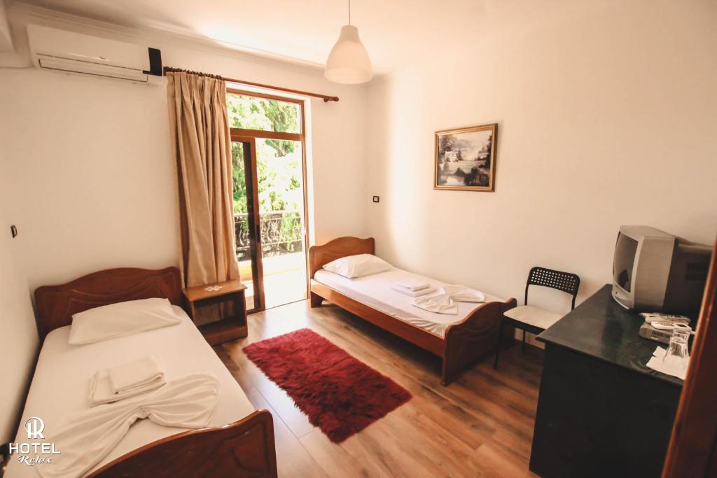 Postel nebo postele na pokoji v ubytování Hotel Relax