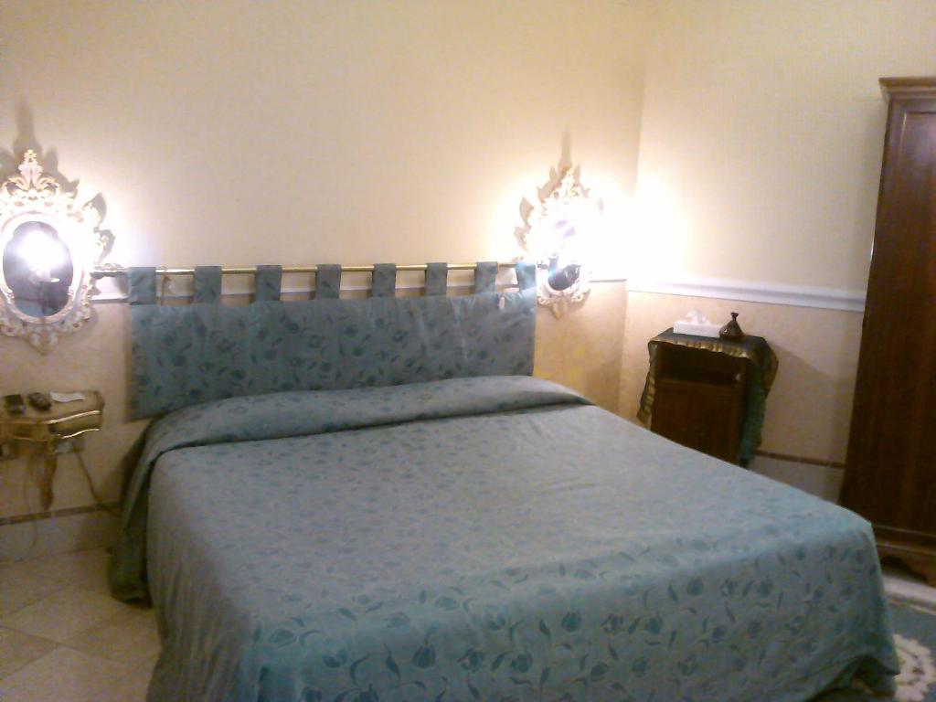 Postel nebo postele na pokoji v ubytování Casa Alla Fenice