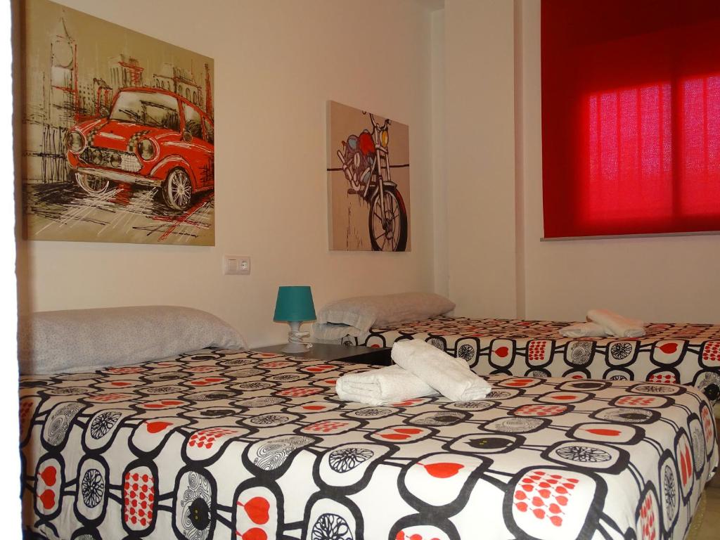 Łóżko lub łóżka w pokoju w obiekcie Apartamento Oropendola 9