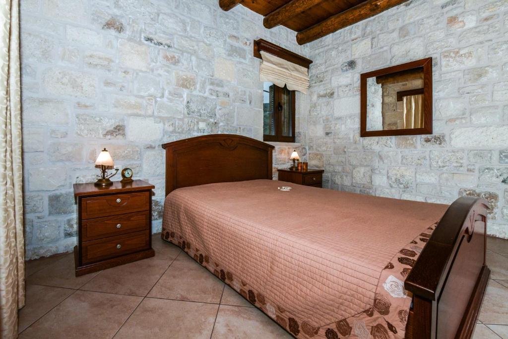 Postel nebo postele na pokoji v ubytování Ariadni Apartments