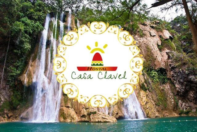 a large sign in front of a waterfall at Hostal Casa Clavel in Ciudad Valles