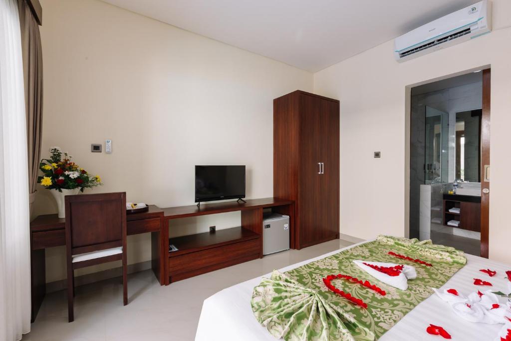 TV a/nebo společenská místnost v ubytování Kubu Benoa Guest House