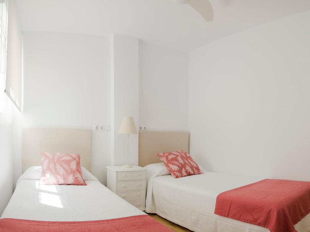 Postel nebo postele na pokoji v ubytování Deluxe La Trinidad