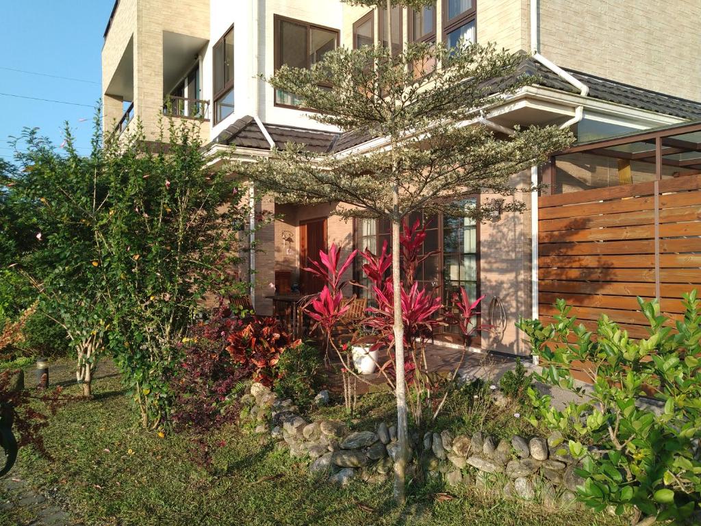 a house with a garden in front of it at Celine&#39;s B&amp;B in Fenglin