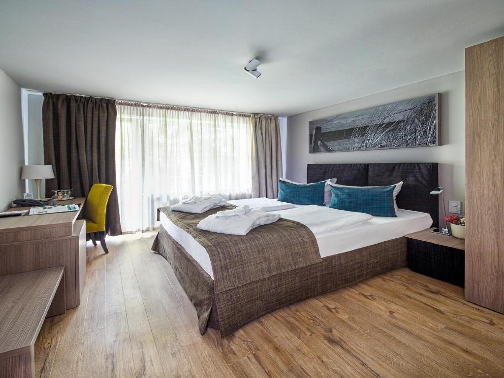 Postel nebo postele na pokoji v ubytování Art Hotel Aachen