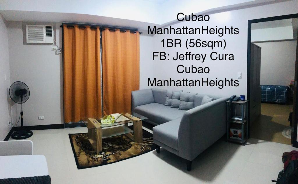 a living room with a couch and a table at Cubao ManhattanHeights Unit 7EF Tower B, 1BR in Manila