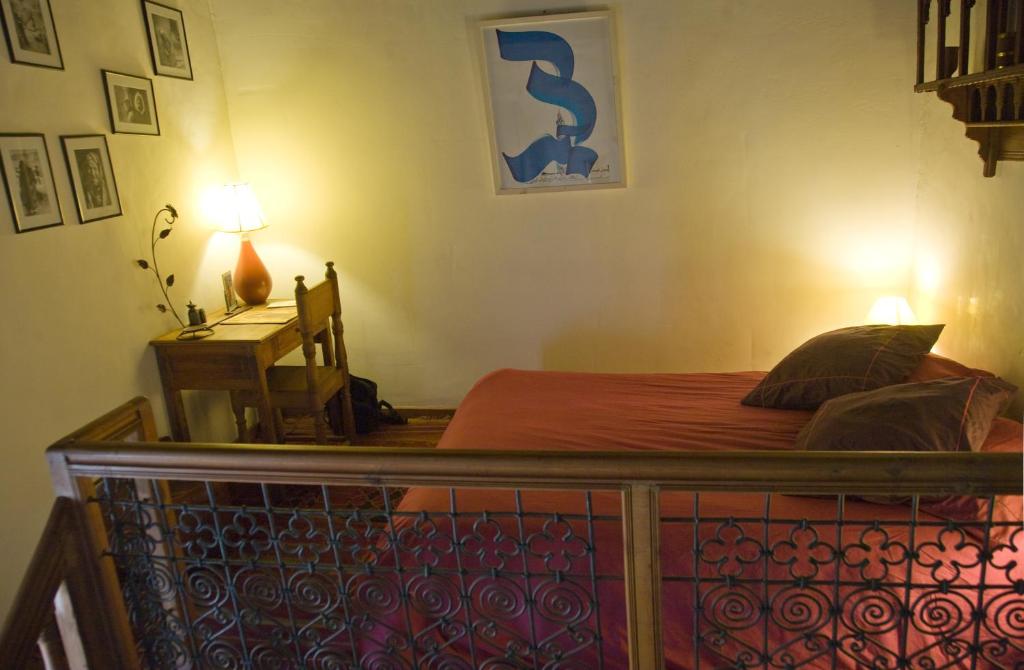 Postel nebo postele na pokoji v ubytování Riad Al Bartal