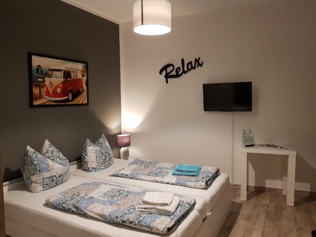 Ein Bett oder Betten in einem Zimmer der Unterkunft Gästezimmer & Ferienwohnung Thon