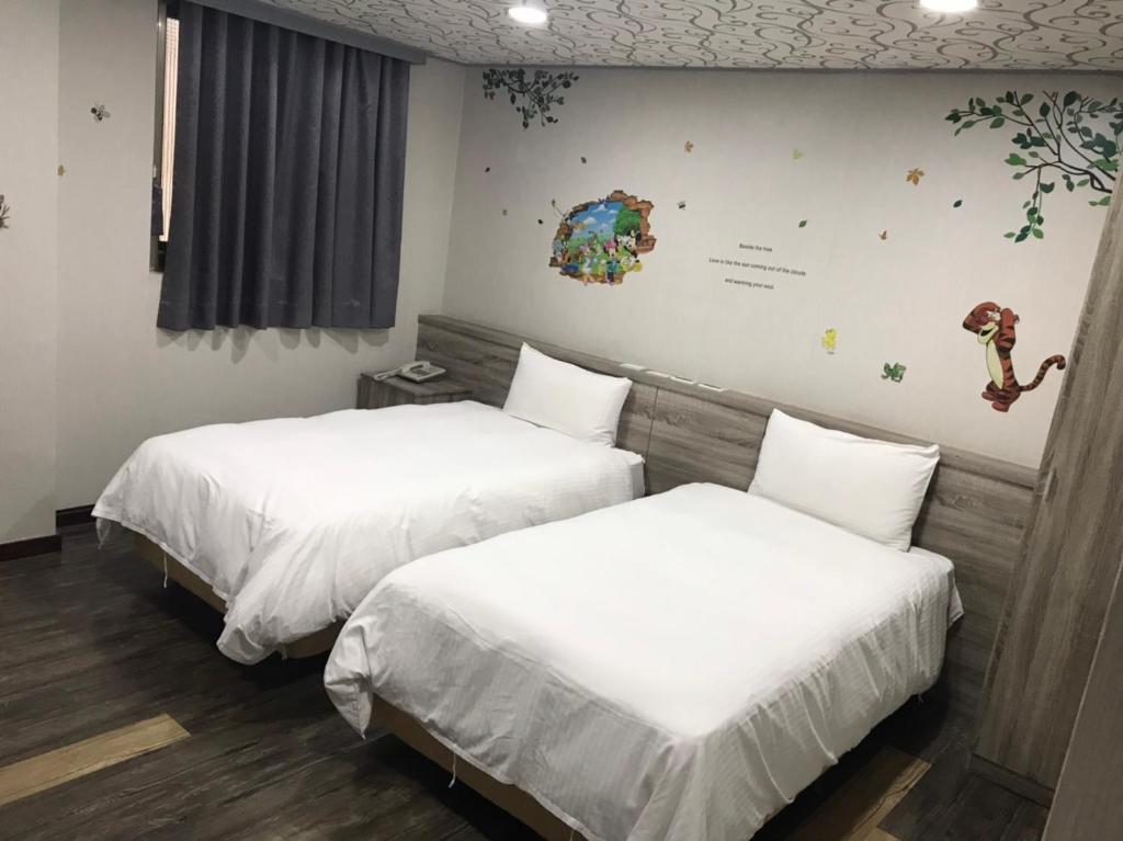 &#x5FC3;&#x5712;&#x751F;&#x6D3B;&#x65C5;&#x5E97; Xin Yuan Hotel&#x623F;&#x9593;&#x7684;&#x5E8A;