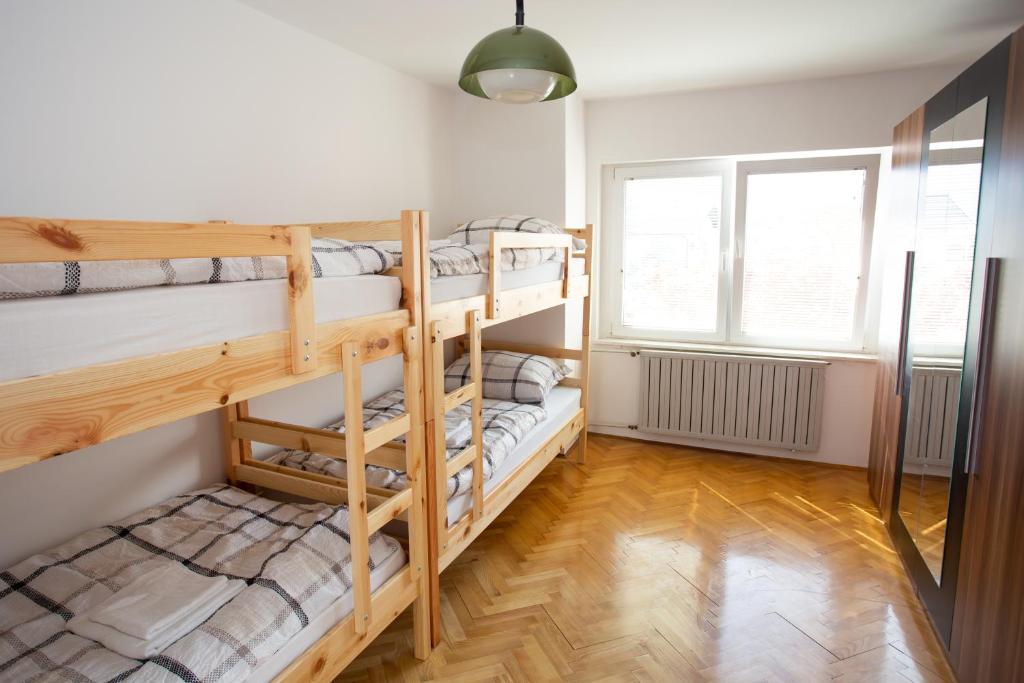 a bedroom with bunk beds in a hostel at Hostel LakeBled in Bled