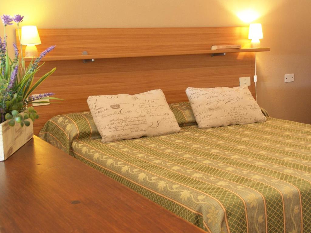Łóżko lub łóżka w pokoju w obiekcie Agriturismo La Quiete