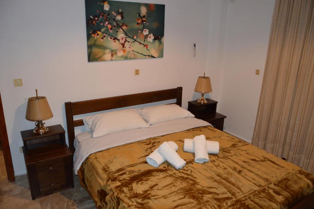 Postel nebo postele na pokoji v ubytování Maria Parameriti Apartments