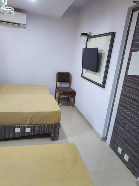 Postel nebo postele na pokoji v ubytování Hotel Apex