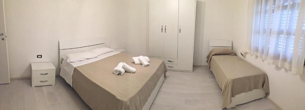 Postel nebo postele na pokoji v ubytování Hotel Due Pini Conte