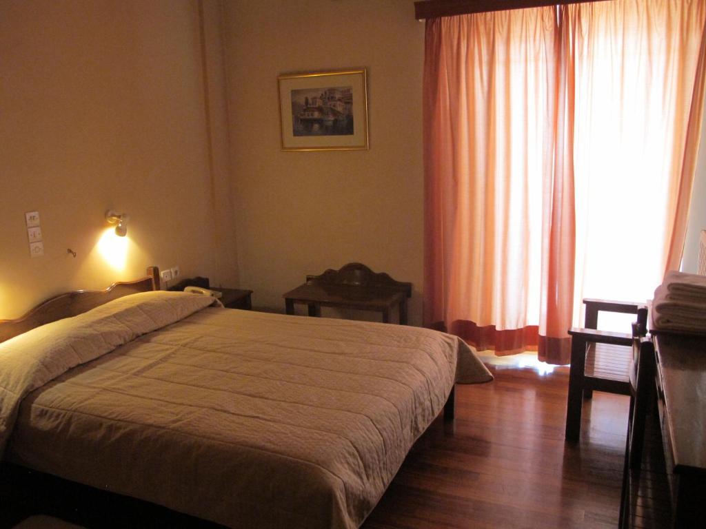 Postel nebo postele na pokoji v ubytování Melissa II Hotel