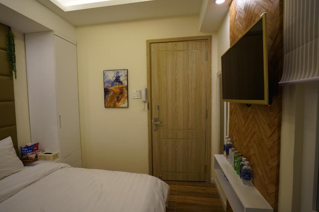Postel nebo postele na pokoji v ubytování Homeland Hotel
