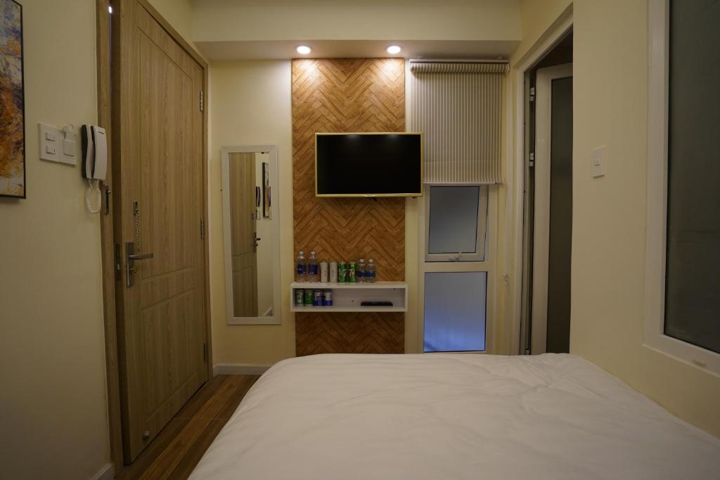 TV a/nebo společenská místnost v ubytování Homeland Hotel