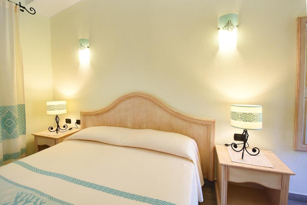 Postel nebo postele na pokoji v ubytování Hotel Su Giganti