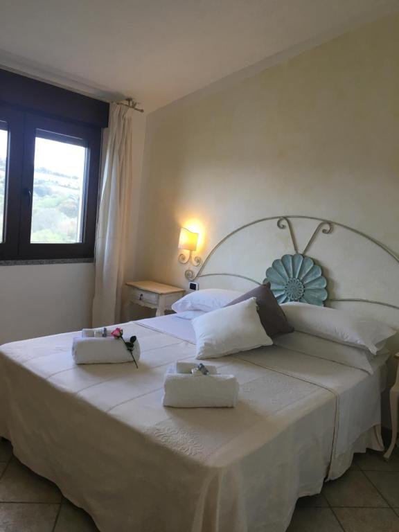 Postel nebo postele na pokoji v ubytování Hotel Sorgente