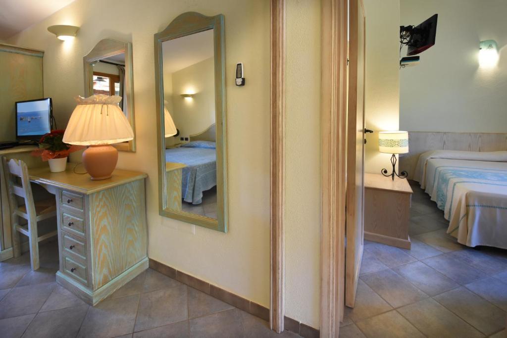 Postel nebo postele na pokoji v ubytování Hotel Su Giganti