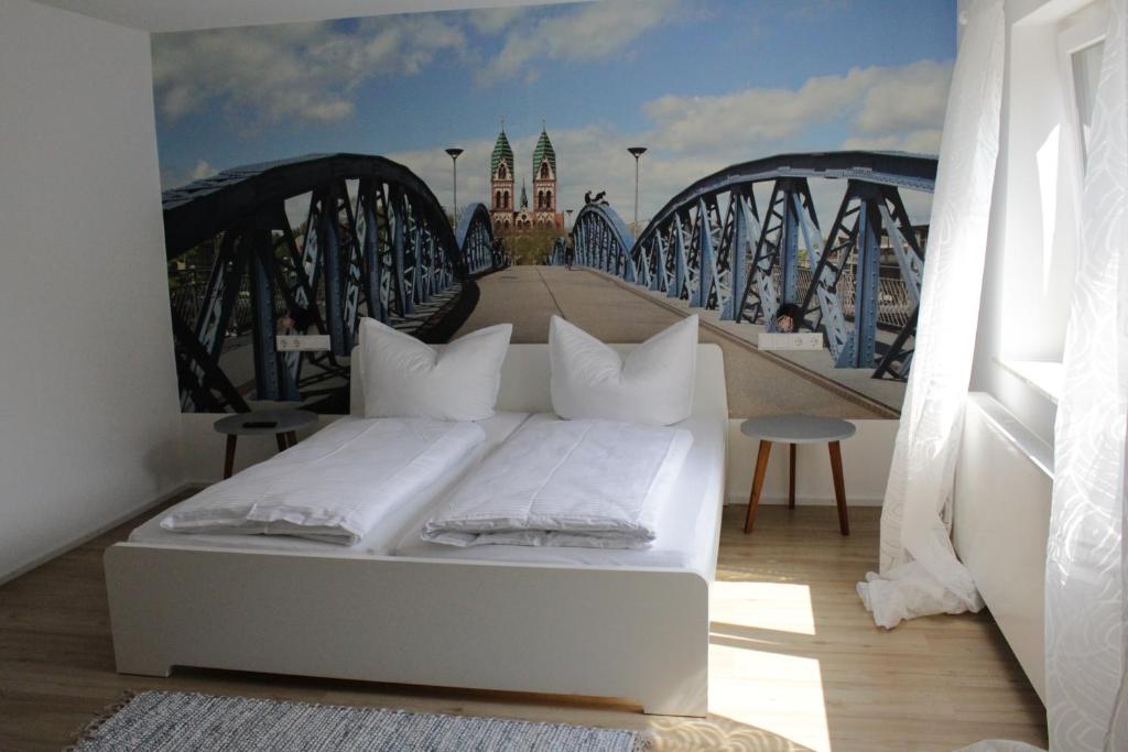 a bed in a room with a bridge at Appartment Moltke in Herbolzheim